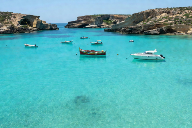 Blue Lagoon Comino turquoise waters with small boats